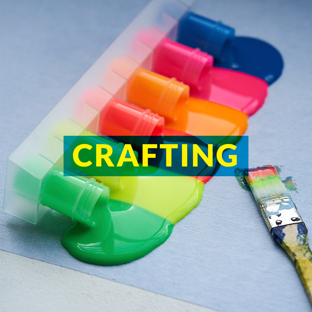 colorful paints spilling onto a Katch surface protection roll