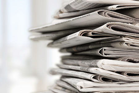 a large stack of newspapers