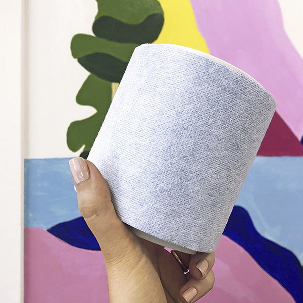 a person holding Katch surface protection roll