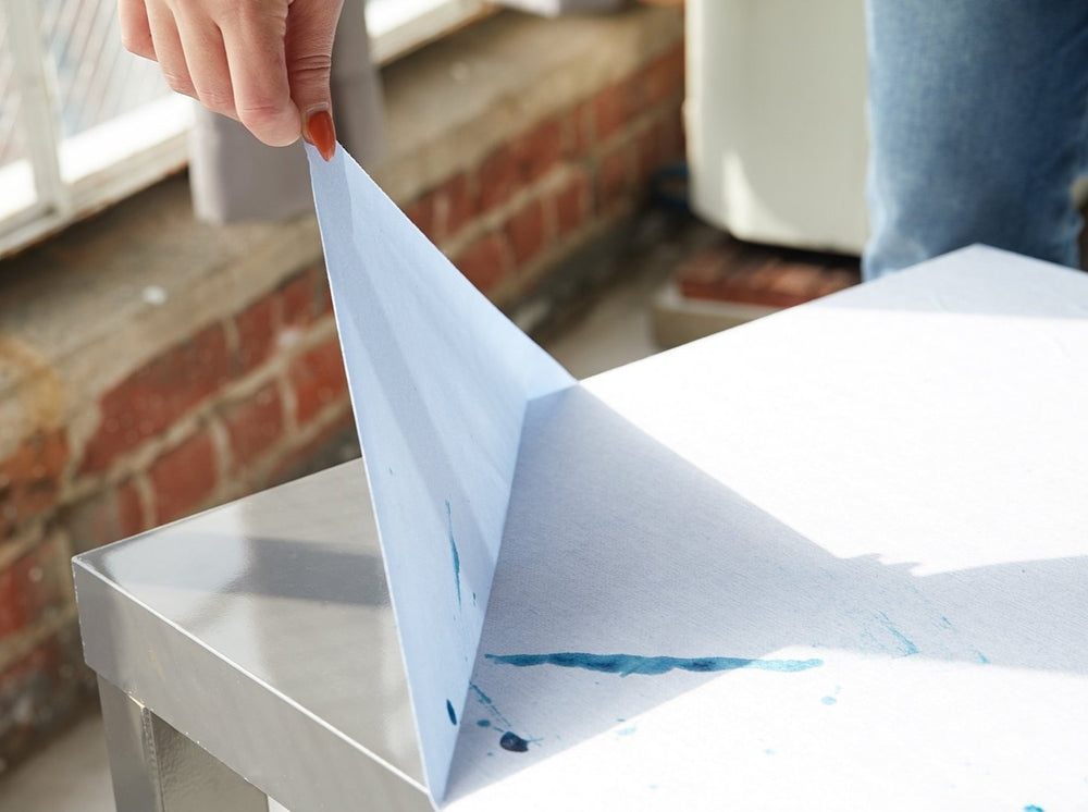 peeling 12" x 5' surface protection off table